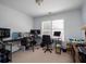 This home office offers ample workspace with multiple computer monitors and lots of light at 1871 Shiloh Valley Nw Way, Kennesaw, GA 30144