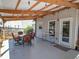 Covered patio with outdoor dining set, providing an ideal spot for relaxing and entertaining at 1871 Shiloh Valley Nw Way, Kennesaw, GA 30144