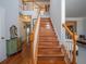 Elegant staircase with wooden steps, white banisters, and a view of the upper level landing at 1871 Shiloh Valley Nw Way, Kennesaw, GA 30144
