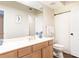 Well-lit bathroom with a light wood vanity and a combined shower and tub at 3777 Peachtree Ne Rd # 1530, Atlanta, GA 30319