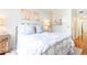 Cozy bedroom with natural lighting, warm hardwood floors, a patterned comforter, and stylish decor at 3777 Peachtree Ne Rd # 1530, Atlanta, GA 30319