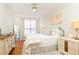 Bright bedroom with a ceiling fan, large window, light hardwood floors, and neutral-toned decor at 3777 Peachtree Ne Rd # 1530, Atlanta, GA 30319
