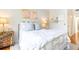 Bright bedroom with natural lighting, hardwood floors, and decoratively adorned walls and bedside table at 3777 Peachtree Ne Rd # 1530, Atlanta, GA 30319