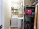 Well-organized laundry room with modern washer and dryer, shelving, and storage solutions at 3777 Peachtree Ne Rd # 1530, Atlanta, GA 30319