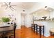 Bright living area featuring hardwood floors, stylish lighting and a breakfast bar area at 3777 Peachtree Ne Rd # 1530, Atlanta, GA 30319