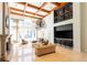 Spacious living room with fireplace, a chandelier, large windows, and a bar area at 3777 Peachtree Ne Rd # 1530, Atlanta, GA 30319