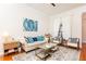 Comfortable living room featuring stylish decor, a decorative rug, and light-filled space with an airy feel at 3777 Peachtree Ne Rd # 1530, Atlanta, GA 30319