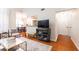 Inviting living room showcases hardwood floors, neutral decor, and open access to dining area at 3777 Peachtree Ne Rd # 1530, Atlanta, GA 30319