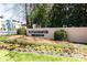 The Peachtree Place sign is visible along with colorful flowers and a green lawn at 3777 Peachtree Ne Rd # 1530, Atlanta, GA 30319