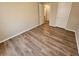 Bedroom with wood-look flooring and two doors at 6406 Laurel Post Dr, Lithonia, GA 30058