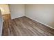 Bedroom featuring hardwood flooring and natural light from the large window at 6406 Laurel Post Dr, Lithonia, GA 30058