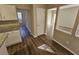 Kitchen dining area with granite countertops, hardwood floors and access to front living room at 6406 Laurel Post Dr, Lithonia, GA 30058