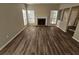 Spacious living room with modern hardwood flooring, a cozy fireplace, and great natural lighting at 6406 Laurel Post Dr, Lithonia, GA 30058