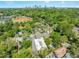 A long shot shows the buildings with lush foliage and the city skyline at 1065 United Ave # 208, Atlanta, GA 30316