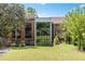 Attractive building exterior with modern architectural features, lush landscaping, and a well-manicured lawn at 1065 United Ave # 208, Atlanta, GA 30316