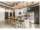 Modern kitchen featuring stainless steel appliances, bar-style seating, and a minimalist design at 1065 United Ave # 208, Atlanta, GA 30316