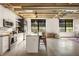 Modern kitchen with white cabinets, stainless steel appliances, a marble backsplash, and large windows at 1065 United Ave # 208, Atlanta, GA 30316