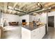 Open-concept living room and kitchen with concrete floors, exposed ceiling, and modern cabinets and appliances at 1065 United Ave # 208, Atlanta, GA 30316