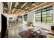 Open-concept living room and kitchen with concrete floors, exposed ceiling, and modern cabinets and appliances at 1065 United Ave # 208, Atlanta, GA 30316