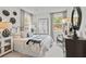Comfortable bedroom with neutral tones, ample natural light, and stylish décor at 1613 Caldwell Bend Ln, Dacula, GA 30019