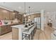 Spacious kitchen with an island, stainless steel appliances, and open layout to the living area at 1613 Caldwell Bend Ln, Dacula, GA 30019
