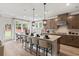 Stylish kitchen with an island, pendant lighting, stainless appliances, and a dining area at 1613 Caldwell Bend Ln, Dacula, GA 30019