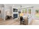 Bright living room with a fireplace, large windows, and comfortable seating area at 1613 Caldwell Bend Ln, Dacula, GA 30019