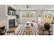 Inviting living room with a fireplace, large windows, and ample seating for guests at 1613 Caldwell Bend Ln, Dacula, GA 30019