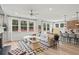 Open-concept living room connected to the kitchen and dining area, filled with natural light at 1613 Caldwell Bend Ln, Dacula, GA 30019
