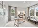 Bright office area with two large windows, neutral walls, and decorative furnishings at 1613 Caldwell Bend Ln, Dacula, GA 30019