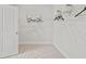 Spacious walk-in closet with neutral carpeting and adjustable wire shelving for optimal storage at 1613 Caldwell Bend Ln, Dacula, GA 30019