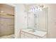 Bathroom vanity with a large mirror, cabinets, and a shower and tub combo at 2303 Pine Heights Ne Dr, Atlanta, GA 30324