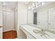 Bright bathroom featuring a large mirror over the vanity and a storage closet at 2303 Pine Heights Ne Dr, Atlanta, GA 30324