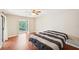 Bedroom featuring hardwood floors and a large window with outdoor views at 2303 Pine Heights Ne Dr, Atlanta, GA 30324
