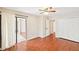 Bedroom featuring hardwood floors, a ceiling fan, and access to a balcony at 2303 Pine Heights Ne Dr, Atlanta, GA 30324