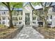 Charming condo building with lush landscaping and elegant entry, exuding curb appeal and inviting ambiance at 2303 Pine Heights Ne Dr, Atlanta, GA 30324