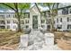 Exterior view of building with elegant entrance and walkway, black trim windows and professionally landscaped yard at 2303 Pine Heights Ne Dr, Atlanta, GA 30324