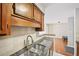 Charming kitchen featuring granite countertops and stainless steel sink and faucet at 2303 Pine Heights Ne Dr, Atlanta, GA 30324