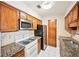 Well-maintained kitchen featuring granite countertops, stainless steel appliances, offering both style and functionality at 2303 Pine Heights Ne Dr, Atlanta, GA 30324