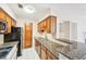 Functional kitchen featuring granite countertops, stainless steel appliances, and ample cabinet space at 2303 Pine Heights Ne Dr, Atlanta, GA 30324