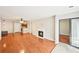 Cozy living room featuring hardwood floors, fireplace, and balcony access, perfect for relaxing and entertaining at 2303 Pine Heights Ne Dr, Atlanta, GA 30324