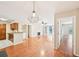 Spacious living room showcasing hardwood floors connecting to the kitchen at 2303 Pine Heights Ne Dr, Atlanta, GA 30324