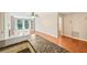 Bright and airy living room with hardwood floors, fireplace, and balcony access at 2303 Pine Heights Ne Dr, Atlanta, GA 30324
