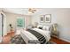 Staged bedroom showcasing great natural light and hardwood floors at 2303 Pine Heights Ne Dr, Atlanta, GA 30324