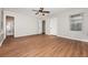 Spacious main bedroom with wood floors, natural light, and ensuite bathroom access at 2938 Parkwood Rd, Snellville, GA 30039