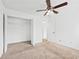 Bedroom with carpet, ceiling fan, and closet at 49 Country Ct, Alpharetta, GA 30005