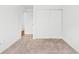Carpeted room with closet and white sliding doors at 49 Country Ct, Alpharetta, GA 30005