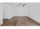 Bright bedroom with ceiling fan, closet, and wood-look floors for a clean, modern feel at 49 Country Ct, Alpharetta, GA 30005