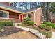 Attractive townhome with well-maintained landscaping and a vibrant red front door at 49 Country Ct, Alpharetta, GA 30005