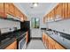 Well-equipped kitchen featuring modern appliances, granite counters, and ample cabinet space at 49 Country Ct, Alpharetta, GA 30005